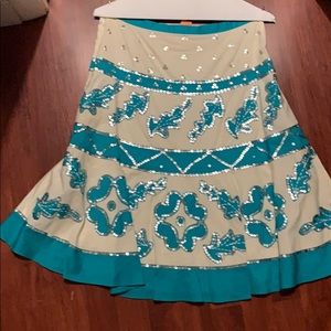 Skirt with sequence beige and blue color.